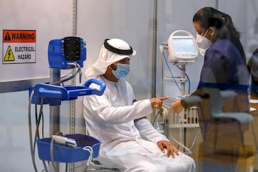Abu Dhabi, United Arab Emirates, August 6, 2020. A vaccine volunteer gets a medical check up at the ADNEC volunteer facility. Victor Besa /The National Section: NA Reporter: Shireena Al Nowais