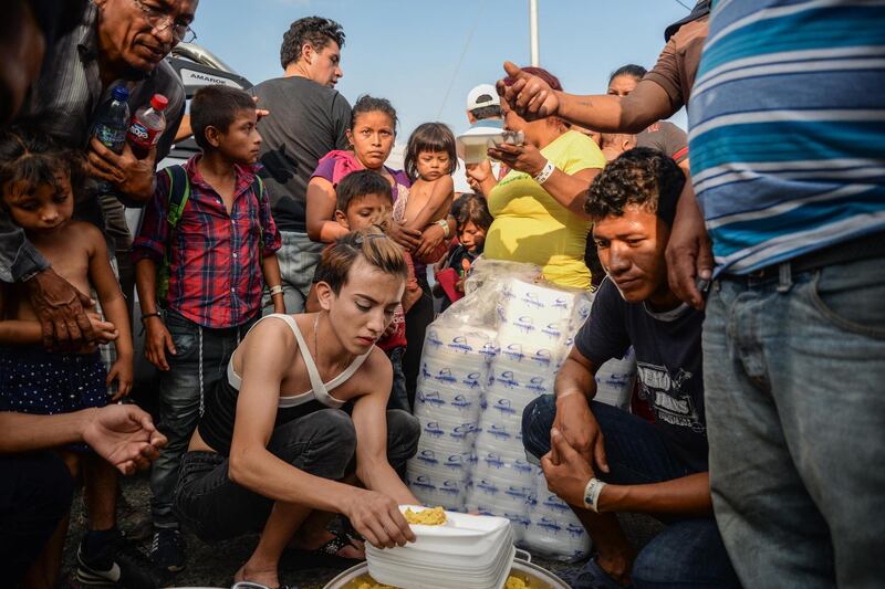 Members of a migrant caravan from Honduras gather for food in Hidalgo City, Chiapas, Mexico.  EPA
