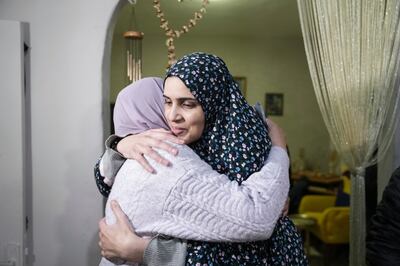 Marah Bakir, right, is welcomed by family in East Jerusalem after her released from Israeli detention. AP