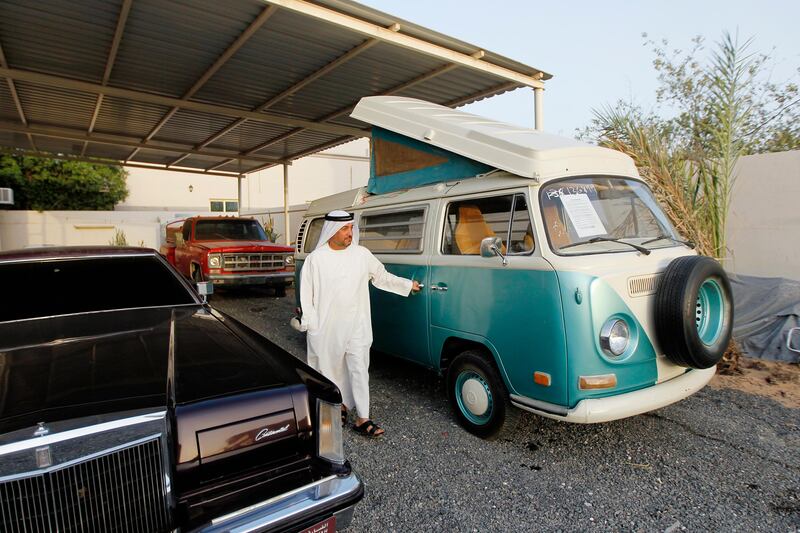 Sharjah, May 9, 2013 - Jasim Mubarak walks by a Volkswagen bus at his family's classic car "garage" in Sharjah, May 9, 2013.(Photo by: Sarah Dea/The National)

