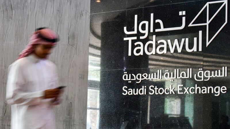 This picture taken December 12, 2019 shows a view of the sign showing the logo of Saudi Arabia's Stock Exchange Market (Tadawul) bourse in the capital Riyadh. Energy giant Saudi Aramco's market value soared above $2 trillion as its share price surged again on its second day of trading. The valuation milestone was sought by Saudi Crown Prince Mohammed bin Salman when he first floated the idea of selling up to five percent of Aramco, the world's largest oil firm, about four years ago. Aramco shares jumped another 9.7 percent to 38.60 riyals ($10.3) on Thursday morning, following a 10-percent rise the previous day. / AFP / FAYEZ NURELDINE
