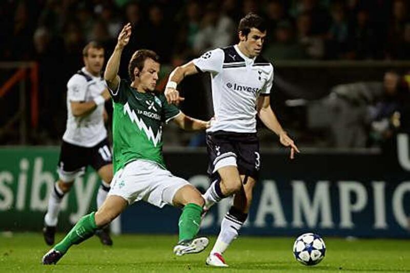 Tottenham's Gareth Bale, right, rides the challenge of Bremen's Philipp Bargfrede during their 2-2 Champions League draw in Germany.