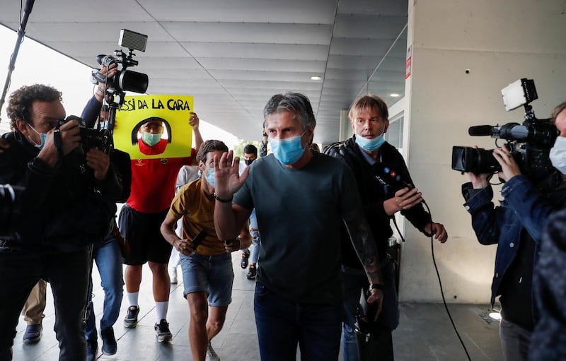 Jorge Messi on his way to a waiting car outside Barcelona airport. Reuters