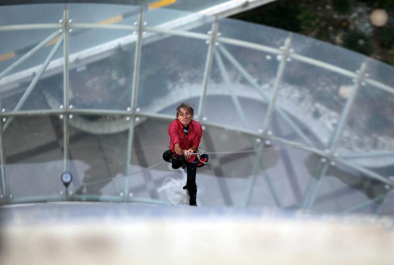 Alain Robert climbs Kuwait City’s Hotel Missoni on February 25, 2014 during celebrations to mark the Gulf emirate’s 53rd National Day and the 23rd Liberation Day. Yasser Al Zayyat / AFP Photo