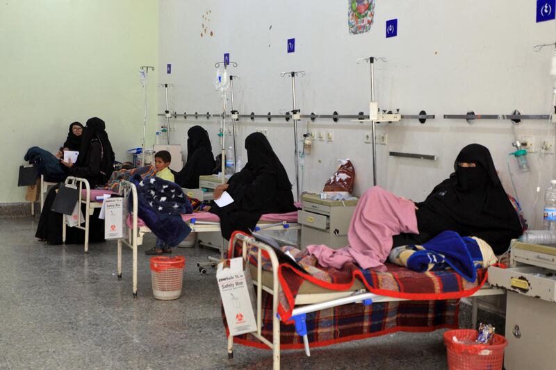 Women sit with their children receiving treatment at al-Sabeen Maternity and Child Hospital in the Yemeni capital Sanaa, on September 19, 2020. - Human Rights Watch warned of "deadly consequences" as a result of the obstruction of aid in war-torn Yemen, where the humanitarian effort has already been badly hit by the coronavirus crisis. Interviews with 35 humanitarian workers, 10 donor officials and 10 Yemeni health workers revealed a complex web of restrictions that hinder the flow of aid. (Photo by Mohammed HUWAIS / AFP)