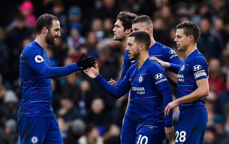 epa07338924 Chelsea's Eden Hazard (C) celebrates with teammate Gonzalo Higuain (L) after scoring against Huddersfield during their English Premier League soccer match at Stamford Bridge, London, Britain, 02 February 2019.  EPA/WILL OLIVER EDITORIAL USE ONLY. No use with unauthorized audio, video, data, fixture lists, club/league logos or 'live' services. Online in-match use limited to 120 images, no video emulation. No use in betting, games or single club/league/player publications