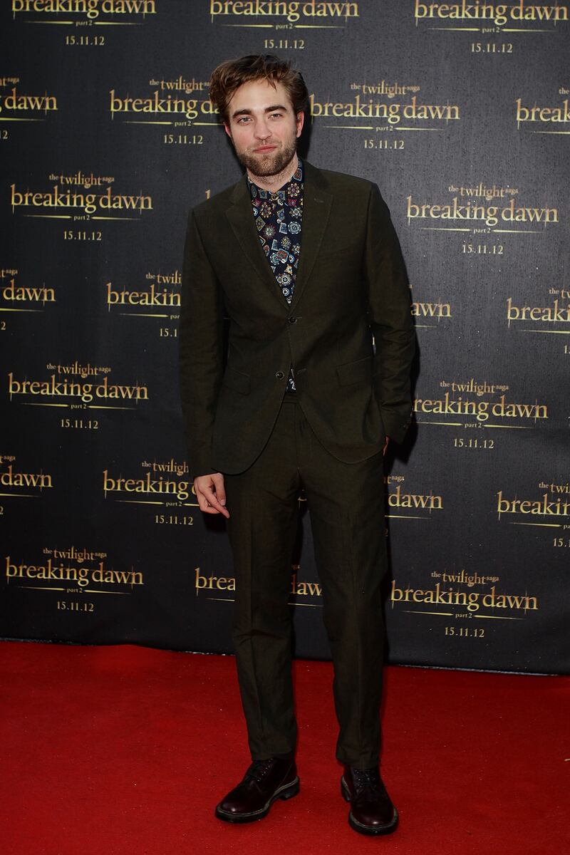 In a brown suit and patterned shirt at a 'Twiight Saga: Breaking Dawn – Part 2' fan event in Sydney, Australia on October 22, 2012. Getty Images