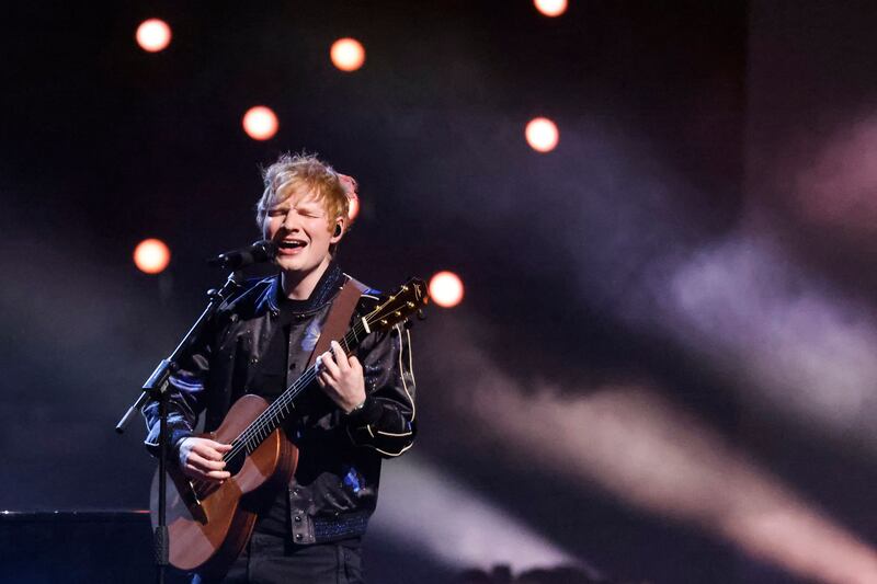 British singer and songwriter Ed Sheeran performs during the live show. AFP