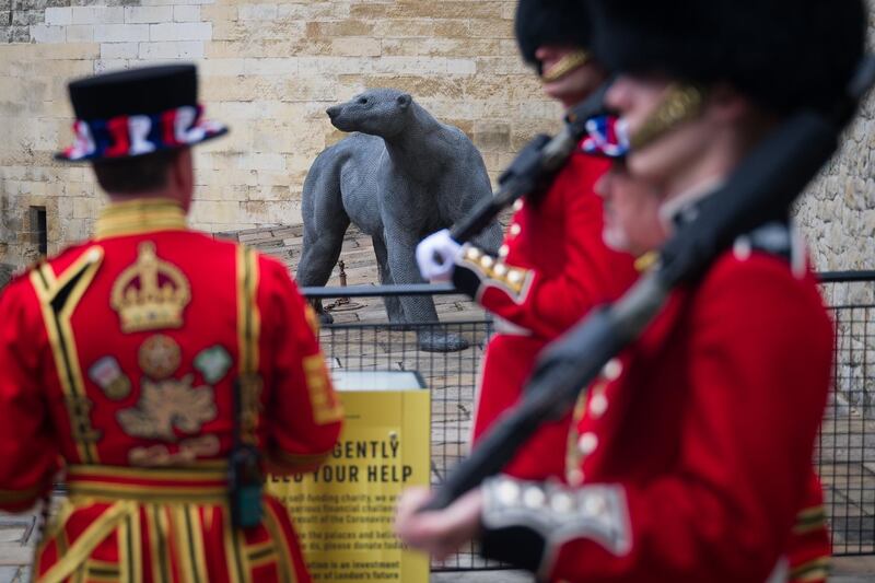 A model of the polar bear gifted to King Henry III by King Haakon of Norway in 1251 is seen as Guardsmen and Yeoman Warders prepare to take part in a ceremonial event to mark the reopening to the public of the Tower of London. Getty Images