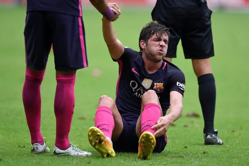 Barcelona full-back Sergi Roberto reacts to getting injured. Eloy Alonso / Reuters