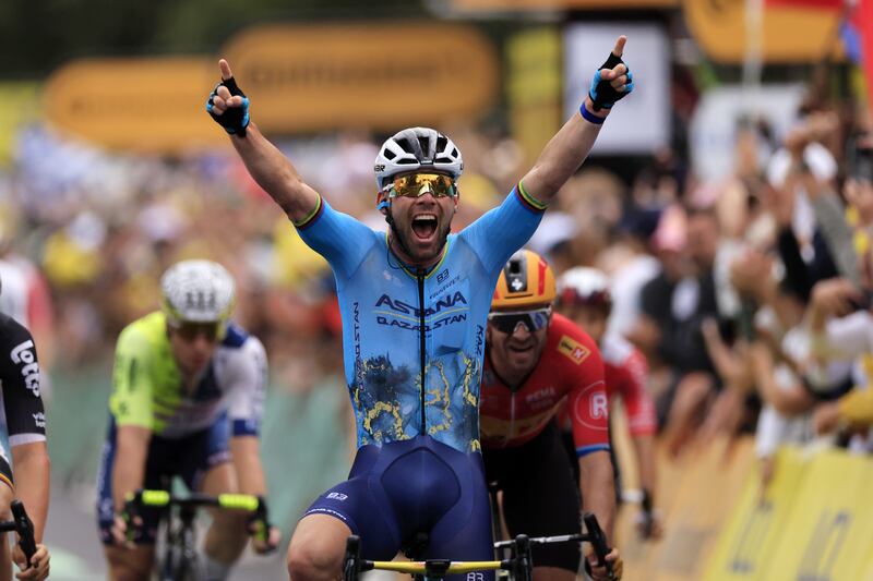 British rider Mark Cavendish of Astana Qazaqstan Team celebrates as he crosses the finish line on Stage 5 to overtake Eddie Merckx with a record 35th Tour de France stage win. EPA