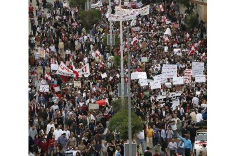 Protesters march in Beirut yesterday calling for an end to Lebanon's confessional political system and alleged corruption. Cynthia Karam / Reuters