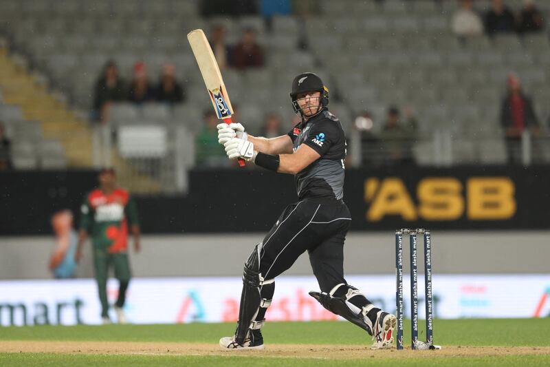 New Zealand's Martin Guptill plays a shot during the third Twenty20 cricket match between New Zealand and Bangladesh in Auckland on April 1, 2021. (Photo by MICHAEL BRADLEY / AFP)