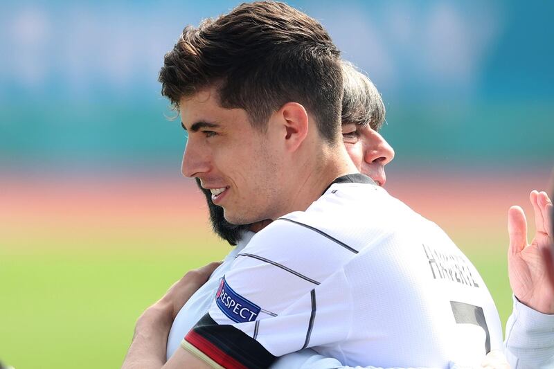 Coach Joachim Low of Germany congratulates Kai Havertz on his 22nd birthday. Getty