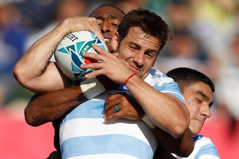 Argentina's fly-half Nicolas Sanchez (front) is tackled by US wing Marcel Brache (L) during the Japan 2019 Rugby World Cup Pool C match between Argentina and the United States at the Kumagaya Rugby Stadium in Kumagaya on October 9, 2019. / AFP / Odd ANDERSEN
