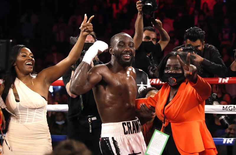 WBO champion Terence Crawford dances with his mother Debra Crawford and other family members after defeating Shawn Porter. AFP