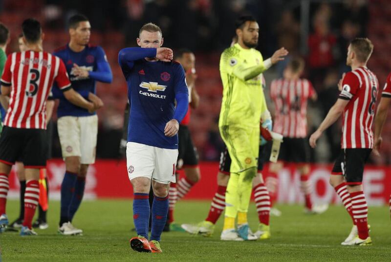 Manchester United's Wayne Rooney has a right to look dejected. Their Premier League campaign will not result in an automatic berth to the Uefa Champions League, again. John Sibley / Reuters

