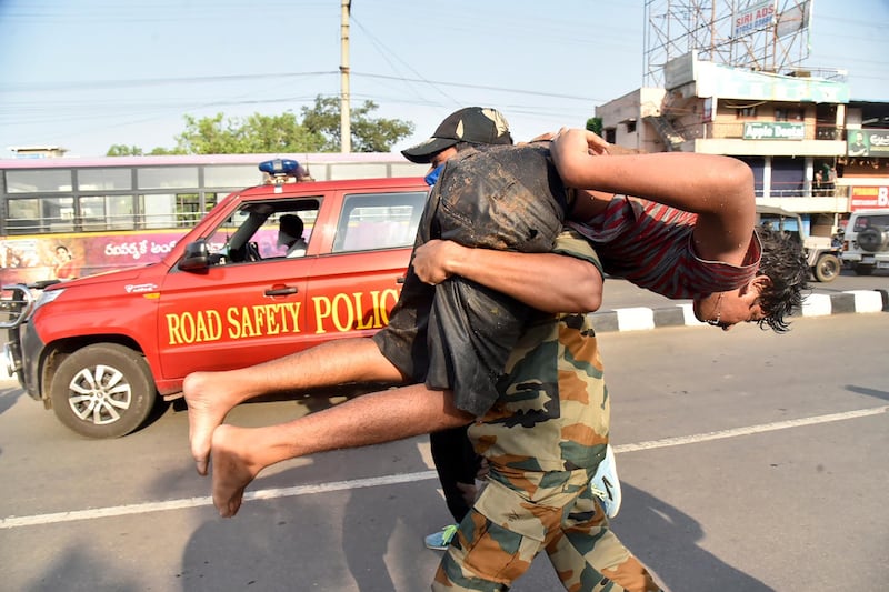 A boy affected by a chemical gas leak is carried for medical treatment in Visakhapatnam, India. AP Photo