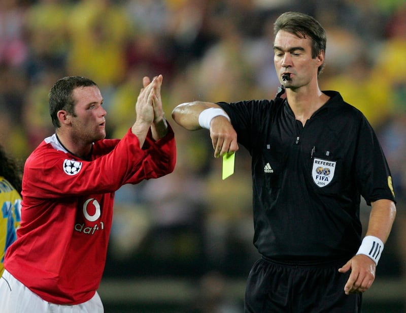 Manchester United's Wayne Rooney gestures toward referee Kim Milton Nielsen after receiving a yellow card and soon after a red one for his reaction during a Champions League match against Villarreal in Villarreal, Spain on September 14, 2005. AP