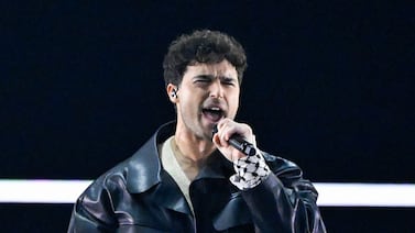 Swedish singer Eric Saade wore the Middle Eastern scarf around his wrist during a guest performance of his song 'Popular' as he opened the first semi-final of the 68th edition of the Eurovision Song Contest in Malmo. AFP
