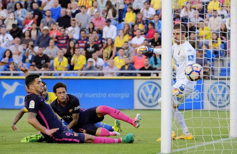 Barcelona’s Uruguayan forward Luis Suarez, left, scores against Las Palmas. Angel Medina G / AFP