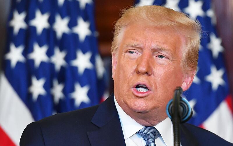 US President Donald Trump speaks during the signing ceremony for a proclamation on the 100th anniversary of the ratification of the 19th Amendment in the Blue Room  of the White House in Washington, DC on August 18, 2020. The 19th Amendment was created giving women in the United States the constitutional right to vote.  / AFP / MANDEL NGAN
