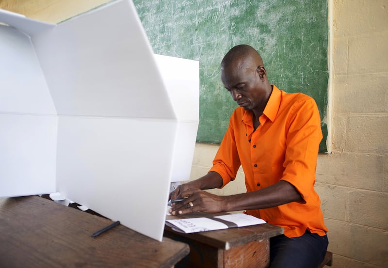 Jovenel Moise, then the presidential candidate of the ruling Parti Haitien Tet Kale, casts his vote at a polling station in Trou-du-Nord, Haiti, in October 2015.