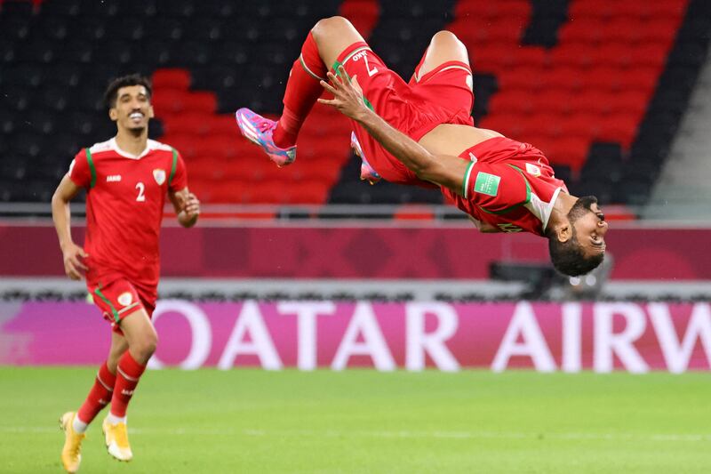 Khalid Al-Hajri of Oman celebrates after scoring the third goal against Bahrain at the Ahmed bin Ali Stadium in Ar Rayyan.