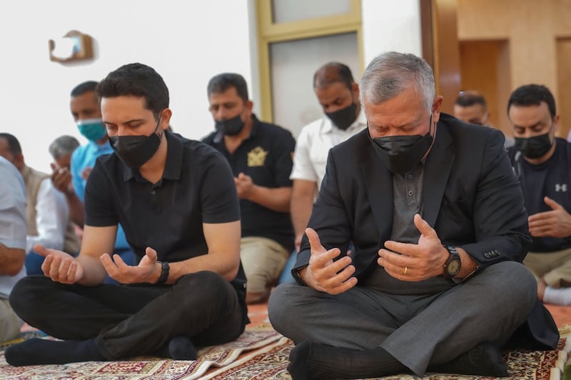 Jordan's King Abdullah and his son Crown Prince Hussein praying at a Royal Guards mosque in Aqaba, Jordan April 8, 2022. AFP