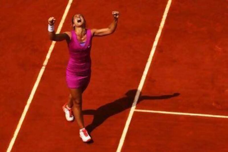 Sara Errani of Italy celebrates victory after her women's singles quarter-final match against Angelique Kerber of Germany. Errani will face Samantha Stosur of Australia next in a semi-final match.