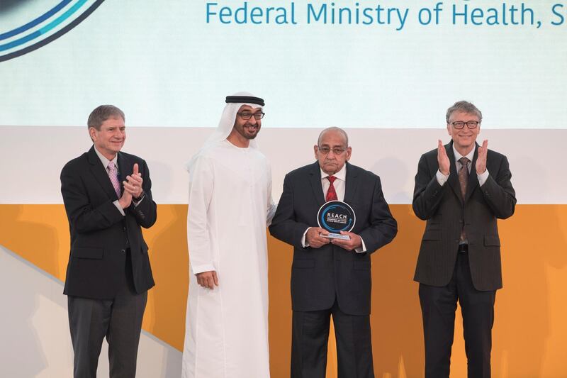 AL MARYAH ISLAND, ABU DHABI, UNITED ARAB EMIRATES - November 15, 2017: HH Sheikh Mohamed bin Zayed Al Nahyan, Crown Prince of Abu Dhabi and Deputy Supreme Commander of the UAE Armed Forces (3rd R), presents a REACH award to  Dr Nabeel Azeez Awadh Allah  (2nd R), during the Global Health Forum. Seen with Bill Gates, Co-chair and Trustee of Bill & Melinda Gates Foundation (R) and Chip Carter (L).

( Hamad Al Kaabi / Crown Prince Court - Abu Dhabi )
---