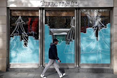 A man walks by a Tiffany & Co shop on the Champs Elysees in Paris. French luxury group LVMH is buying the chain in its biggest-ever acquisition. EPA