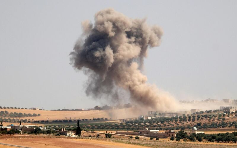 Smoke billows during pro-regime bombardments in the area of Maar Hitat in Syria's northern Idlib province on August 20, 2019. Jihadists and allied rebels withdrew from a key area of northwestern Syria today, a monitor said, as President Bashar al-Assad's forces pressed an offensive against the jihadist-run Idlib region. Turkey warned Damascus "not to play with fire" a day after a Syrian regime air strike sought to deter a new Turkish military convoy from entering the area.
 / AFP / Omar HAJ KADOUR
