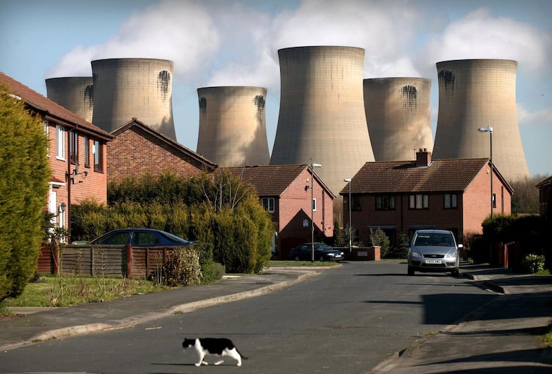 A cat crosses the road on a housing development in the shadow of Drax Power station, near Selby in north Yorkshire, U.K., Tuesday, March 13, 2007.
Photographer: Graham Barclay/Bloomberg News