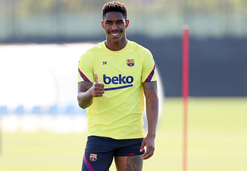 Spanish defender Junior Firpo gives a thumbs-up during the training session at the Ciutat Esportiva Joan Gamper in Sant Joan Despi
