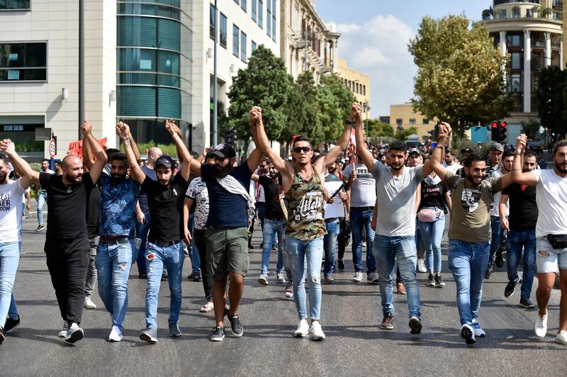 Demonstrators march in downtown Beirut.  EPA