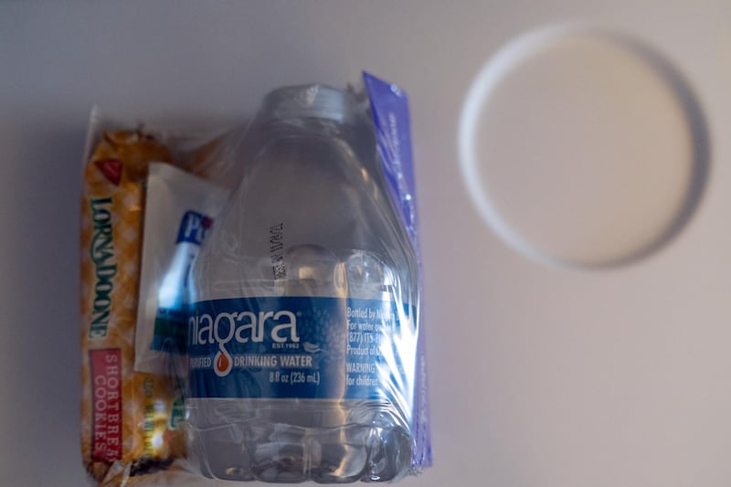 A snack, bottled water and hand sanitiser sealed in plastic during the Avelo Airlines inaugural flight. Bloomberg