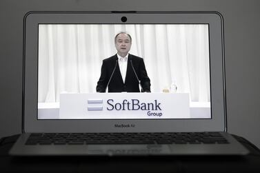 Masayoshi Son, chairman of SoftBank Group, speaks during the company's annual general meeting seen on a laptop computer in Tokyo. Mr Son said he’s departed the board of Chinese e-commerce titan Alibaba, saying he’s “graduating” from his most successful investment by far. Bloomberg