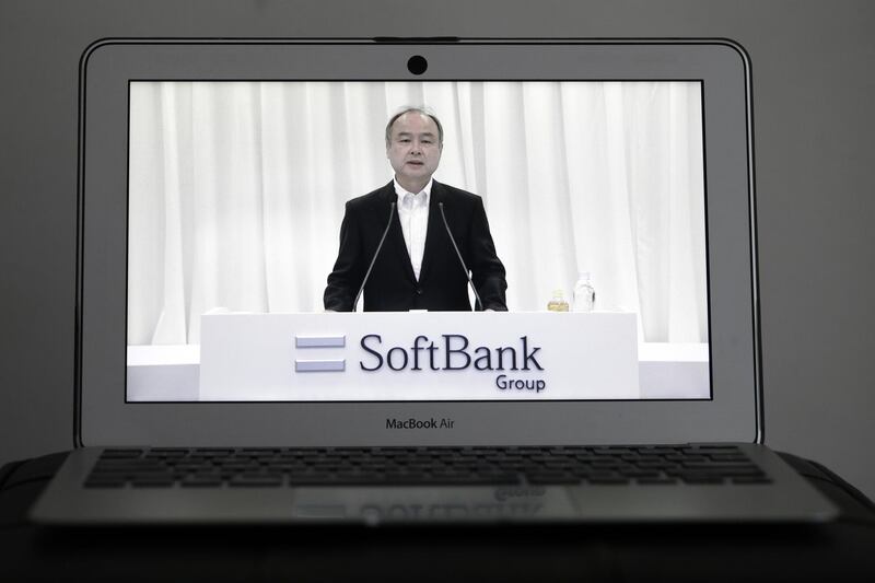 Masayoshi Son, chairman and chief executive officer of SoftBank Group Corp., speaks during the company's annual general meeting seen on a laptop computer in Tokyo, Japan, on Thursday, June 25, 2020. Son said he’s departed the board of Chinese e-commerce titan Alibaba Group Holding Ltd. as of Thursday, saying he’s “graduating” from his most successful investment by far. Photographer: Kiyoshi Ota/Bloomberg