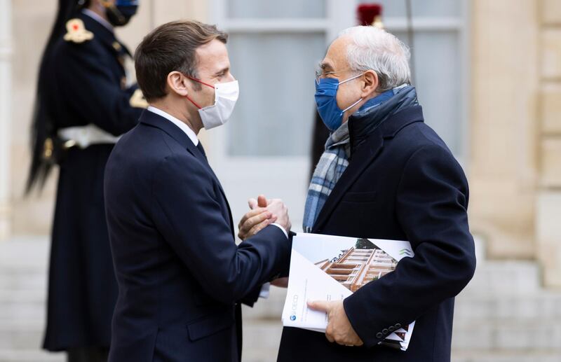 Macron with OECD's Secretary General Angel Gurria in Paris on14 December. EPA
