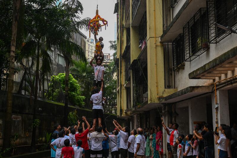 Devotees play Dahi Handi in Mumbai. AFP