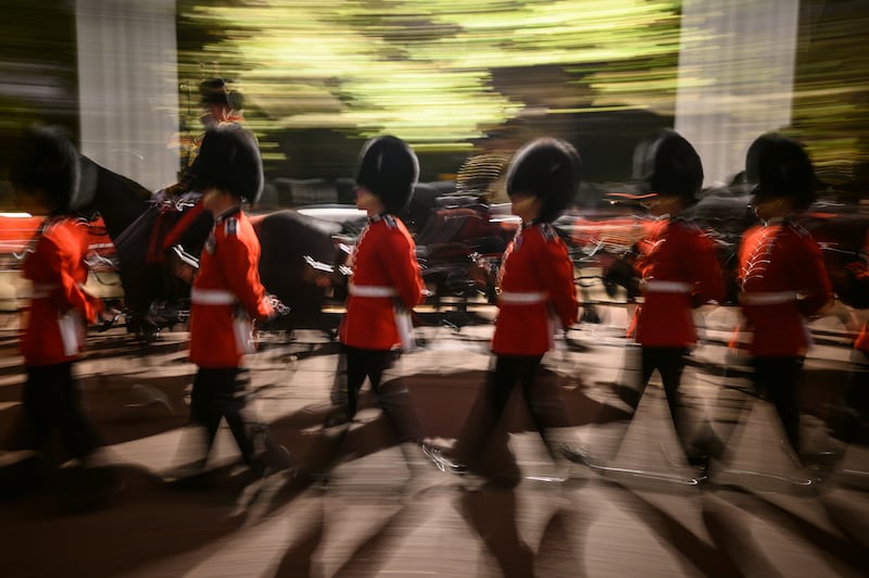 Guardsmen march from Buckingham Palace to the Palace of Westminster during the early morning rehearsal. Getty Images