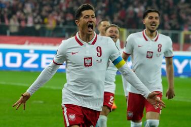 Poland's Robert Lewandowski celebrates after scoring the opening goal of his team during the World Cup 2022 playoff soccer match between Poland and Sweden at Silesian Stadium, in Chorzow, southern Poland, Tuesday, March 29, 2022.  (AP Photo / Czarek Sokolowski)