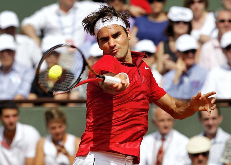 PARIS, FRANCE - JUNE 05:  Roger Federer of Switzerland hits a forehand during the men's singles final match between Rafael Nadal of Spain and Roger Federer of Switzerland on day fifteen of the French Open at Roland Garros on June 5, 2011 in Paris, France.  (Photo by Matthew Stockman/Getty Images)