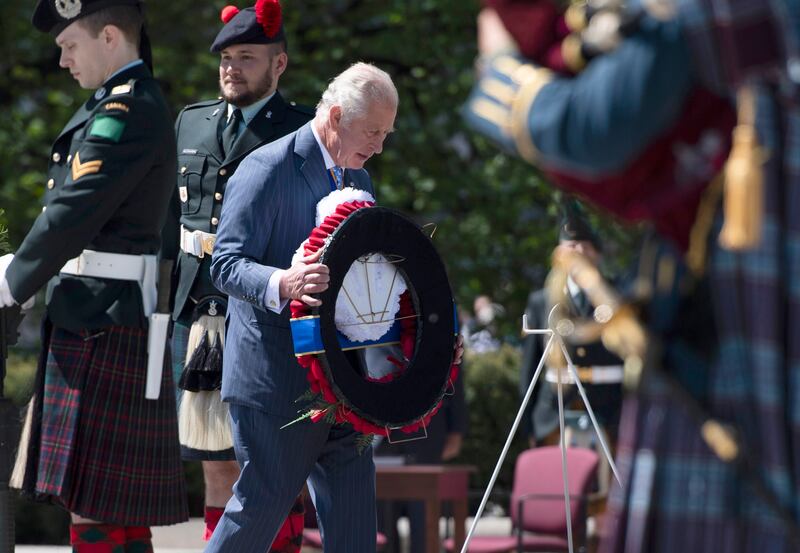 Prince Charles and Camilla, Duchess of Cornwall participate in a wreath laying ceremony at the National War Memorial in Ottawa, during their Canadian Royal tour, on Wednesday, May 18, 2022.  AP