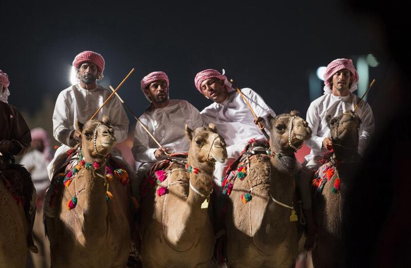 Preseneters take a moment for a photo during the opening ceremony of the Festival of Sheikh Zayed Heritage 2014. Wam