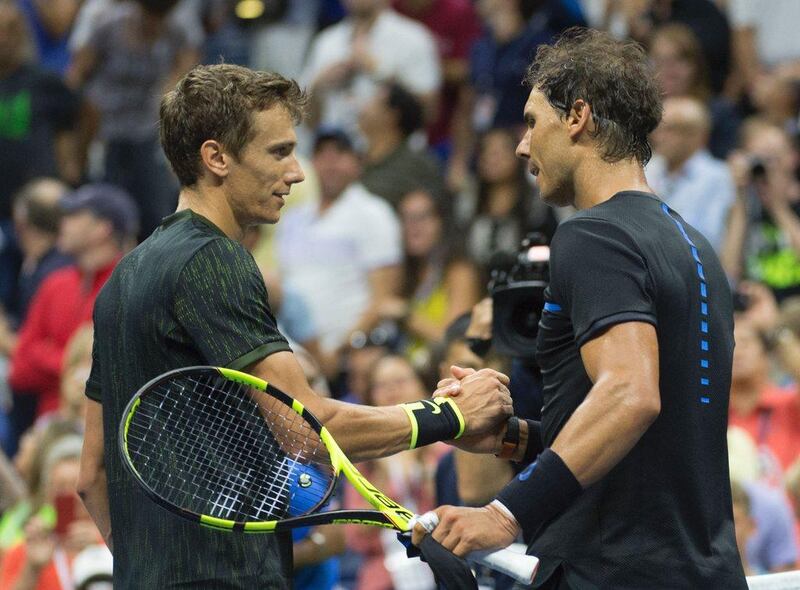 Rafael Nadal meets Andrey Kuznetsov after their US Open third round match. Don Emmert / AFP