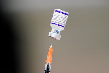 FILE - A syringe is prepared with the Pfizer COVID-19 vaccine at a vaccination clinic at the Keystone First Wellness Center in Chester, Pa. , on Dec.  15, 2021.  Pfizer is expected to request authorization for an additional COVID-19 booster dose for seniors.  (AP Photo / Matt Rourke, File)