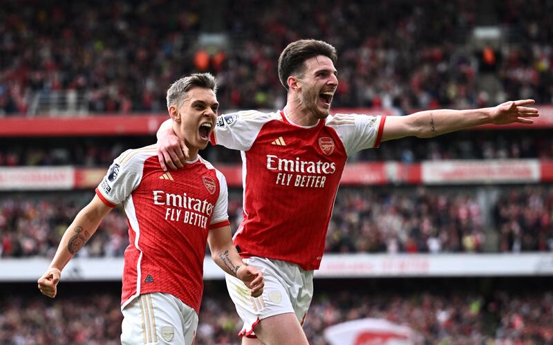 Leandro Trossard, left, celebrates with Declan Rice after scoring Arsenal's second goal in their 3-0 Premier League win over Bournemouth at the Emirates Stadium on May 4, 2024. Reuters