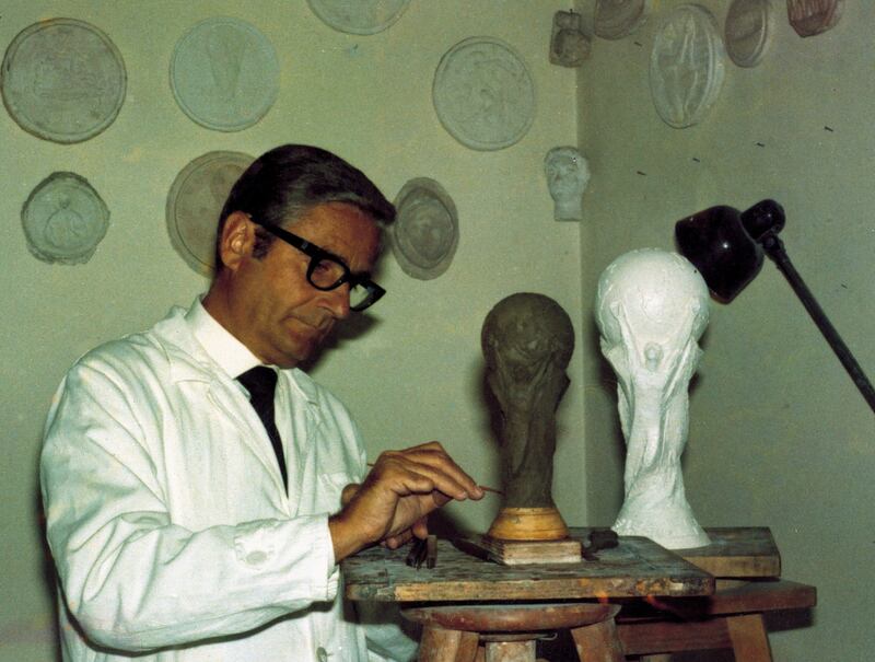 Gazzaniga, the sculptor and designer, at work in 1971. In a month's time, his famous trophy will once again be held aloft, but by which nation? Reuters